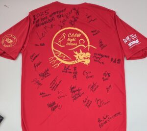 CAAW Night Heron team with everyone's signature on the shirt